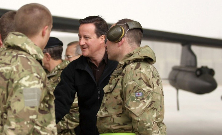 Britain's Prime Minister David Cameron is introduced to British soldiers at Kandahar airfield during a visit to British forces in Afghanistan