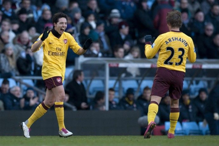 Arsenal's Nasri celebrates with teammate Arshavin after scoring a goal against Aston Villa during their English Premier League soccer match at Villa Park in Birmingham.