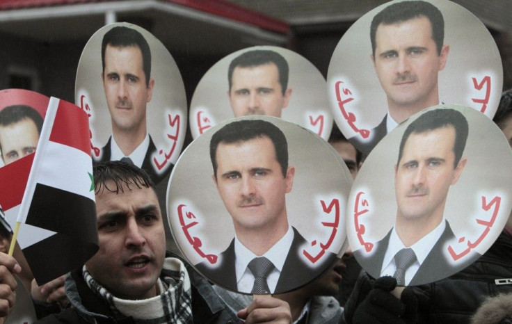 A Syrian citizen takes part in a rally in support of President Bashar al-Assad in front of the Syrian embassy in Minsk