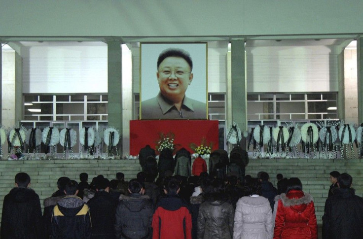 North Koreans make a call of condolence for deceased leader Kim Jong-il in Pyongyang