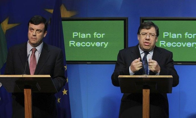 Ireland's Prime Minister Brian Cowen (R) speaks during a news conference, with Finance Minister Brian Lenihan, in Government Buildings, Dublin November 24, 2010.