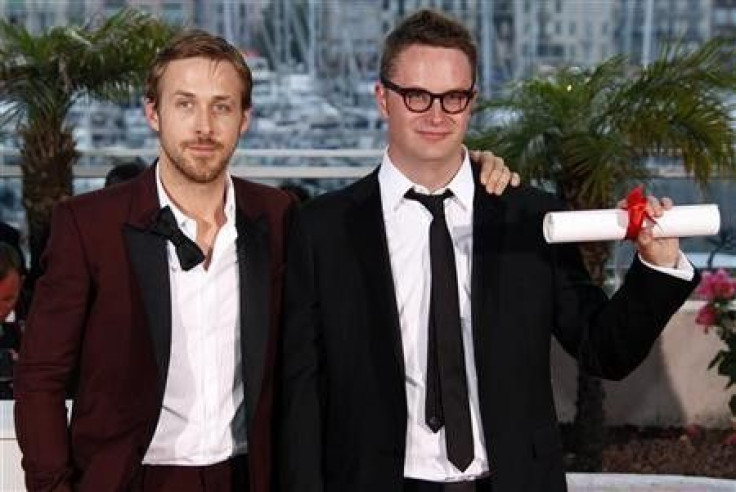 Director Nicolas Winding Refn (R) and cast member Ryan Gosling pose for photographers after receiving the Best Director award for the film &#039;&#039;Drive&#039;&#039; during the closing ceremony of the 64th Cannes Film Festival