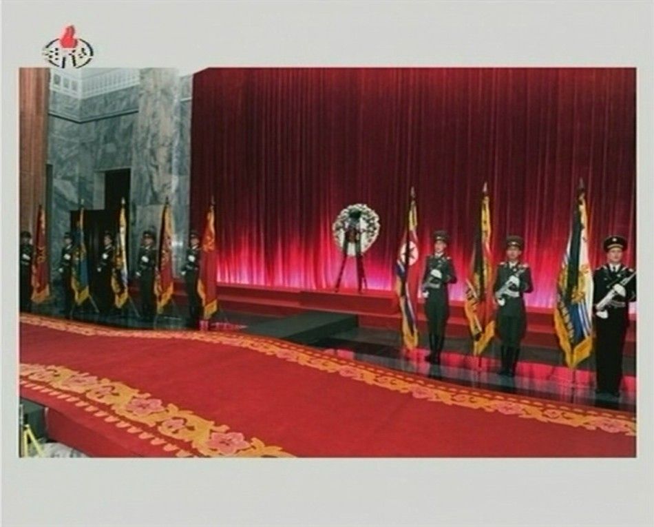 Military guards of honour of the Korean Peoples Army and the Worker-Peasant Red Guards stand at attention as former North Korean leader Kim Jong-il lies in state at the Kumsusan Memorial Palace in Pyongyang in this still picture taken from video foo