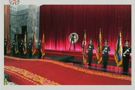 Military guards of honour of the Korean People's Army and the Worker-Peasant Red Guards stand at attention as former North Korean leader Kim Jong-il lies in state at the Kumsusan Memorial Palace in Pyongyang in this still picture taken from video foo