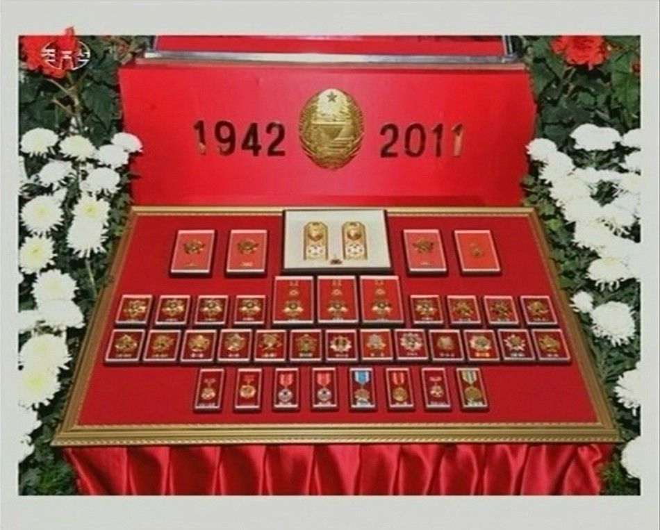 Medals belonging to former North Korean leader Kim Jong-il are displayed as he lies in state at the Kumsusan Memorial Palace in Pyongyang in this still picture taken from video footage of still images aired by KRT Korean Central TV of the North December