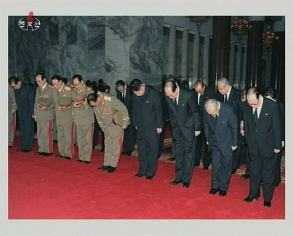 New North Korean ruler Kim Jong-un 4th R, high level party members and generals bow as they pay their respects to former leader Kim Jong-il lying in state at the Kumsusan Memorial Palace in Pyongyang in this still picture taken from video footage of sti