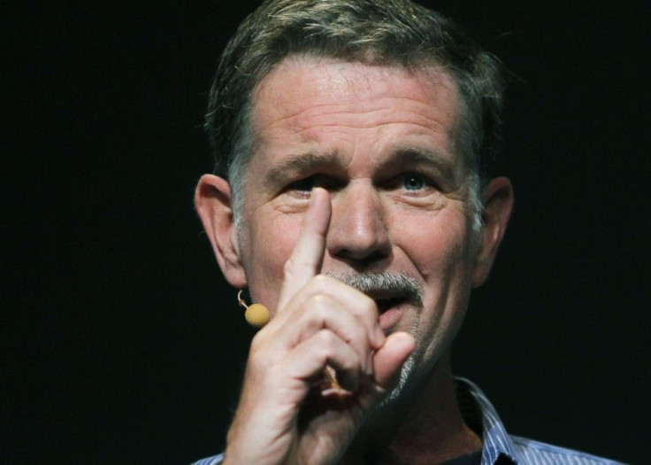 Netflix CEO Reed Hastings gestures while speaking at the Facebook f8 Developers Conference in San Francisco