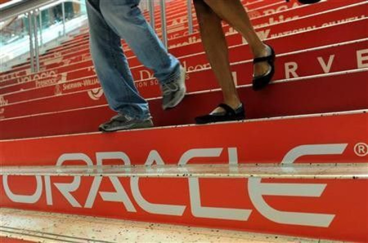 Attendees walk down branded steps at the 29th Oracle OpenWorld in San Francisco October 2, 2011.