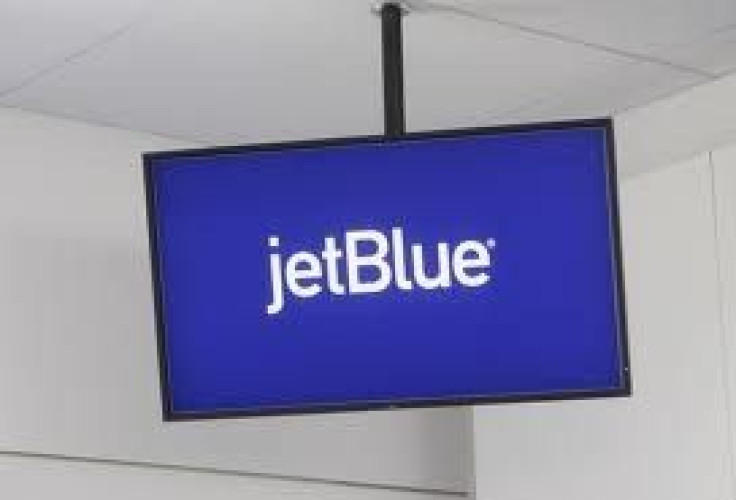 JetBlue Airways logo is displayed on a monitor in Terminal 5 at JFK International Airport in New York