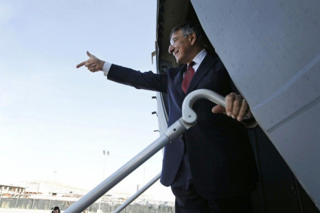U.S. Secretary of of Defense Leon Panetta gestures as he prepares to depart Tripoli