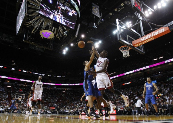 Orlando Magic&#039;s Anderson and Miami Heat&#039;s Harris battle for a rebound during their pre-season NBA basketball game in Miami