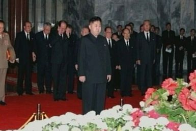 New North Korean ruler Kim Jong-un pays his respects to his father and former leader Kim Jong-il lying in state at the Kumsusan Memorial Palace in Pyongyang