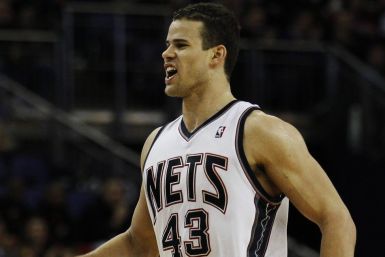 New Jersey Nets' Humphries celebrates after scoring in the 4th quarter of the NBA game against the Toronto Raptors in London