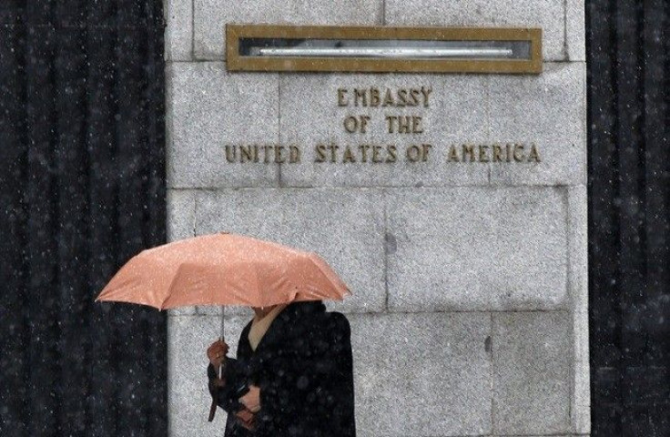 A woman walks past the U.S. embassy in Madrid November 29, 2010.