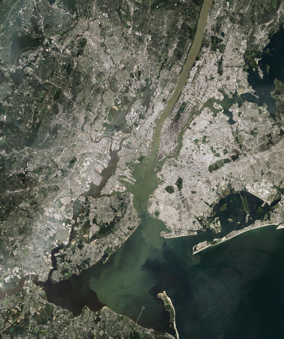 NASA satellite image shows sediment from Hurricane Irene rains and flooding emptying into New York Harbor from the Hudson River