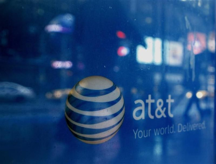 Reflections are seen in the window of an AT&T store in New York