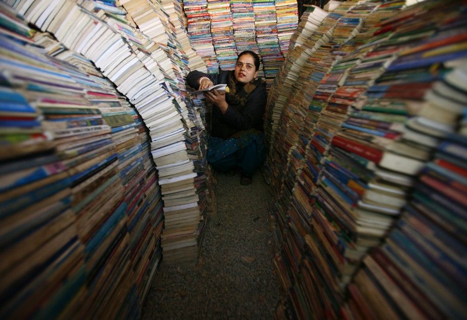 Sapkota arranges books at her book store in Kathmandu