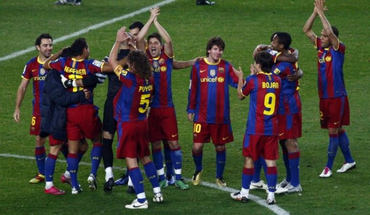 Barcelona's players celebrate victory over Real Madrid at the end of their Spanish first division soccer match in Barcelona.
