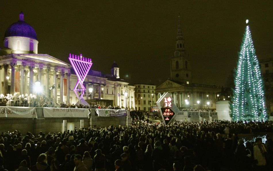 Crowds watch as a giant menorah is lit for the Jewish festival of Hanukkah in Trafalgar Square in London