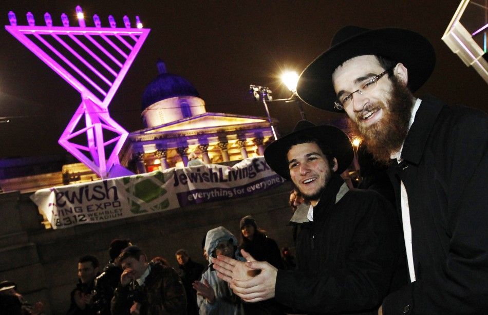 Crowd members join in for the Jewish festival of Hanukkah in Trafalgar Square in London