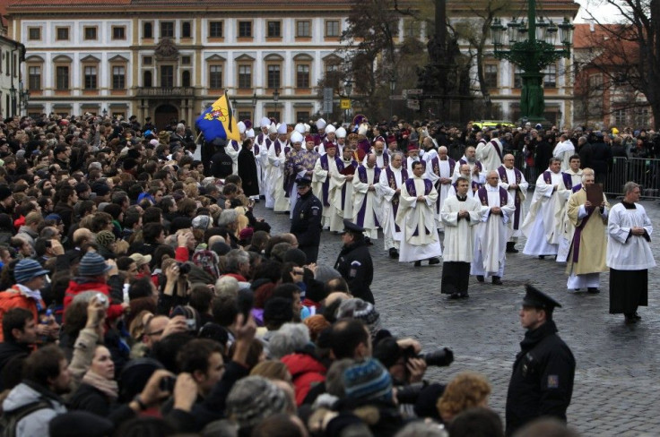 Catholic priests walk in line to attend the funeral ceremony for the late former President Havel at Prague Castle&#039;s St. Vitus Cathedral