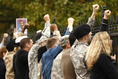 In an act of civil disobedience, demonstrators handcuff themselves to the fence at the White House and shout their protests against the military's &quot;don't ask, don't tell&quot; policy in Washington November 15, 2010