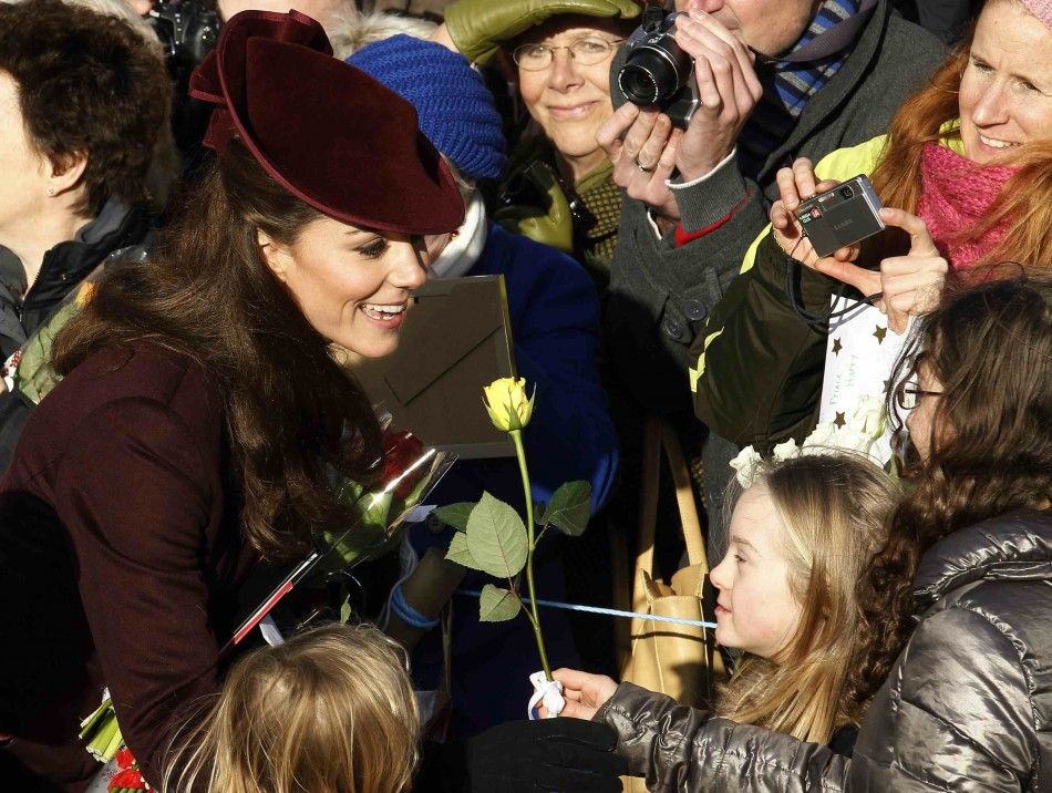 Britains Catherine, the Duchess of Cambridge greets well-wishers after leaving a Christmas Day service at St Mary Magdalene Church on the Royal estate at Sandringham, Norfolk in east England 