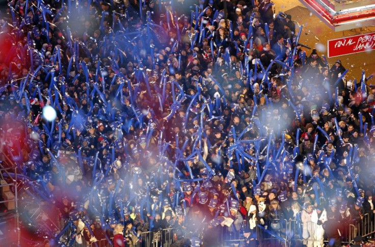 Confetti is dropped on revellers marking two hours to midnight during New Year's Eve celebrations in Times Square in New York