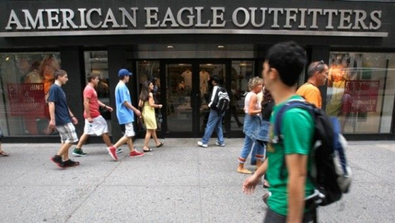 Pedestrians walk past an American Eagle Outfitters store in New York
