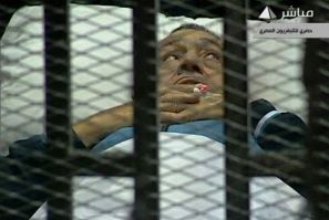 Hosni Mubarak on his caged bed in court