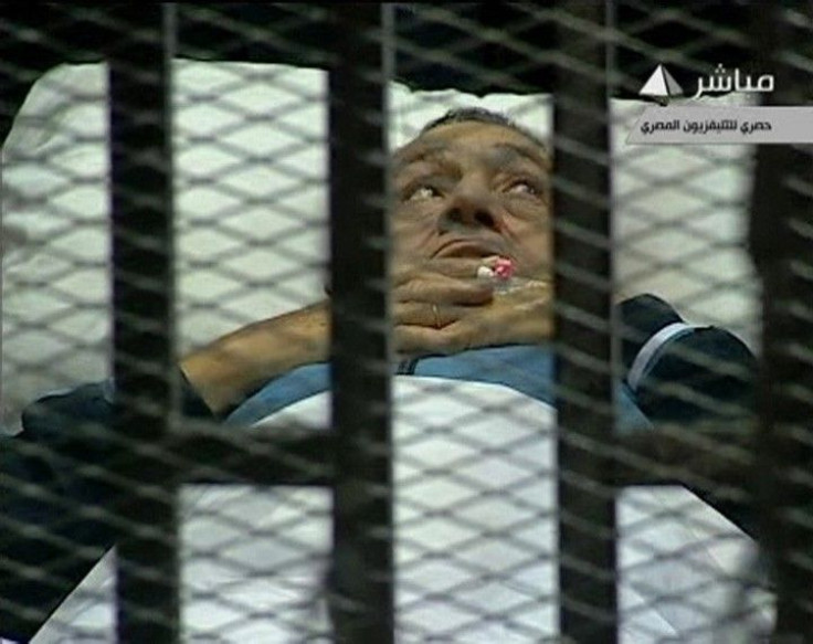 Hosni Mubarak on his caged bed in court