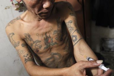 Tuan Anh Nguyen, 45, injects a syringe filled with heroin in his rented room in Hanoi. Researchers at Mexico's National Institute of Psychiatry say they have successfully tested a heroin vaccine on mice and are preparing to test it on humans.