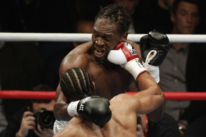 British boxer Haye lands a punch on compatriot Harrison their WBA world heavyweight title fight in Manchester.