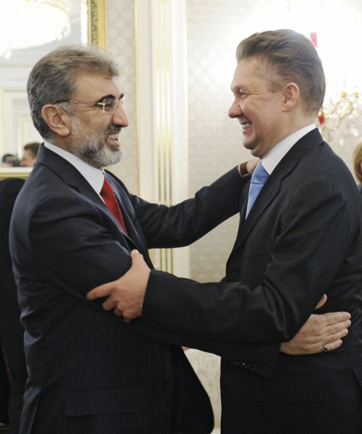 Gazprom CEO Miller greets Turkish Energy Minister Yildiz during their meeting in Moscow