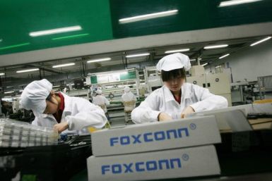 Employees work inside a Foxconn factory in the township of Longhua in the southern Guangdong province in this May 26, 2010 file photo.