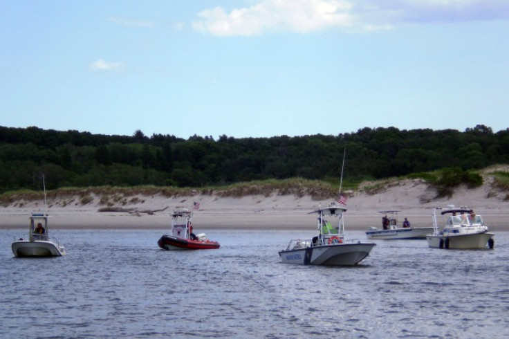 Boats conduct an oil boom deployment exercise at Plum Island in Massachussets on June 8, 2010.