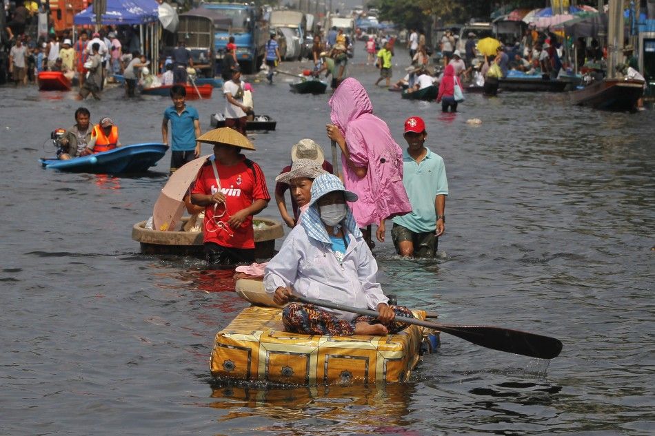 People use makeshift rafts in Thailand