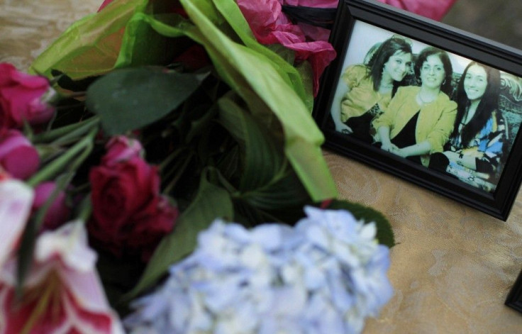 Photograph of vicitms of Christmas Day murder-suicide shown during candlelight vigil in Grapevine, Texas