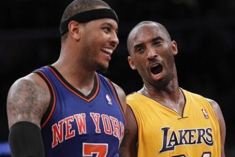 Los Angeles Lakers' Kobe Bryant (R) talks with New York Knicks' Carmelo Anthony (L) as the Lakers lead the Knicks during second half of their NBA basketball game in Los Angeles