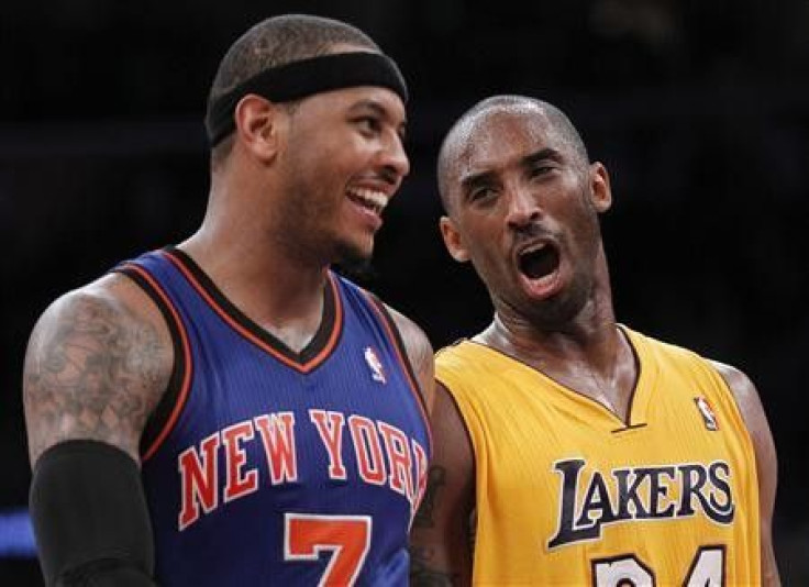 Los Angeles Lakers' Kobe Bryant (R) talks with New York Knicks' Carmelo Anthony (L) as the Lakers lead the Knicks during second half of their NBA basketball game in Los Angeles