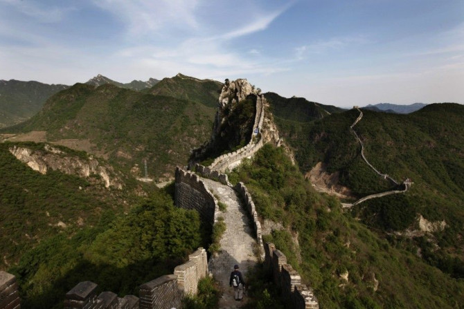 A visitor walks on the Luanling section of the Great Wall, in Huairou District