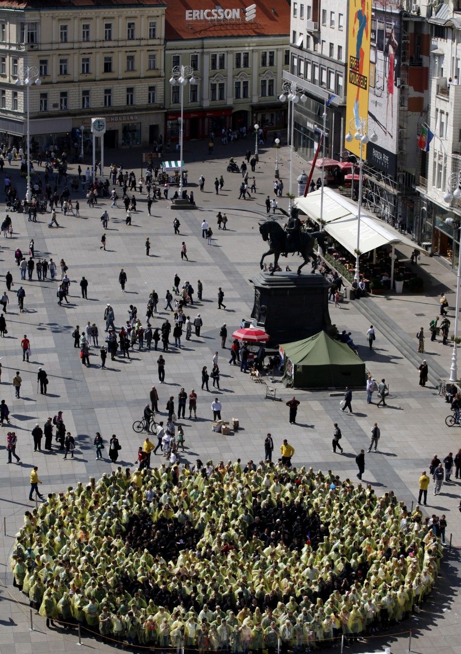 People stand together as they create the biggest human smiley in the world on the Zagreb main square 