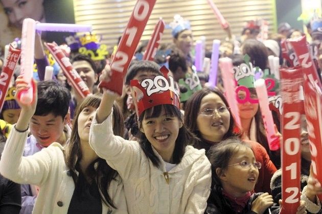 Revelers take part in the New Years eve celebration in Times Square shopping centre in Hong Kong December 31, 2011.