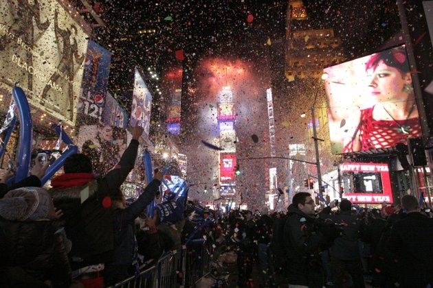 Confetti rains down on revelers at midnight during New Year039s Eve celebrations in Times Square in New York, January 1, 2012.