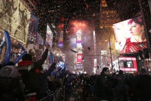 Confetti rains down on revelers at midnight during New Year&#039;s Eve celebrations in Times Square in New York, January 1, 2012.