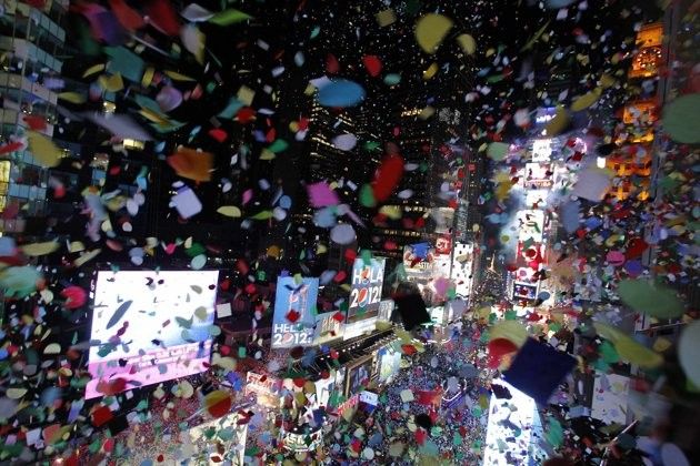 Confetti is dropped on revellers at midnight during New Year039s Eve celebrations in Times Square in New York, January 1, 2012.