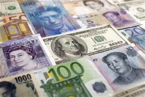 Arrangement of various world currencies including Chinese Yuan, Japanese Yen, US Dollar, Euro, British Pound, Swiss Franc and pictured in Warsaw