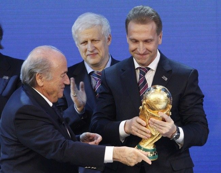 FIFA president Sepp Blatter (L) hands over a copy of the World Cup to Russia's Deputy Prime Minister Igor Shuvalov after the announcement that Russia is going to be host nation for the FIFA World Cup 2018, in Zurich December 2, 2010. 