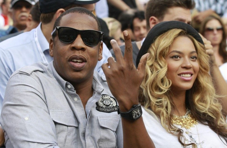 Beyonce Knowles (R) and husband Jay-Z