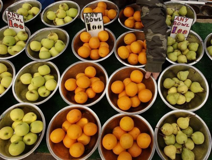 A market stall owner displays fruits in Leicester, central England